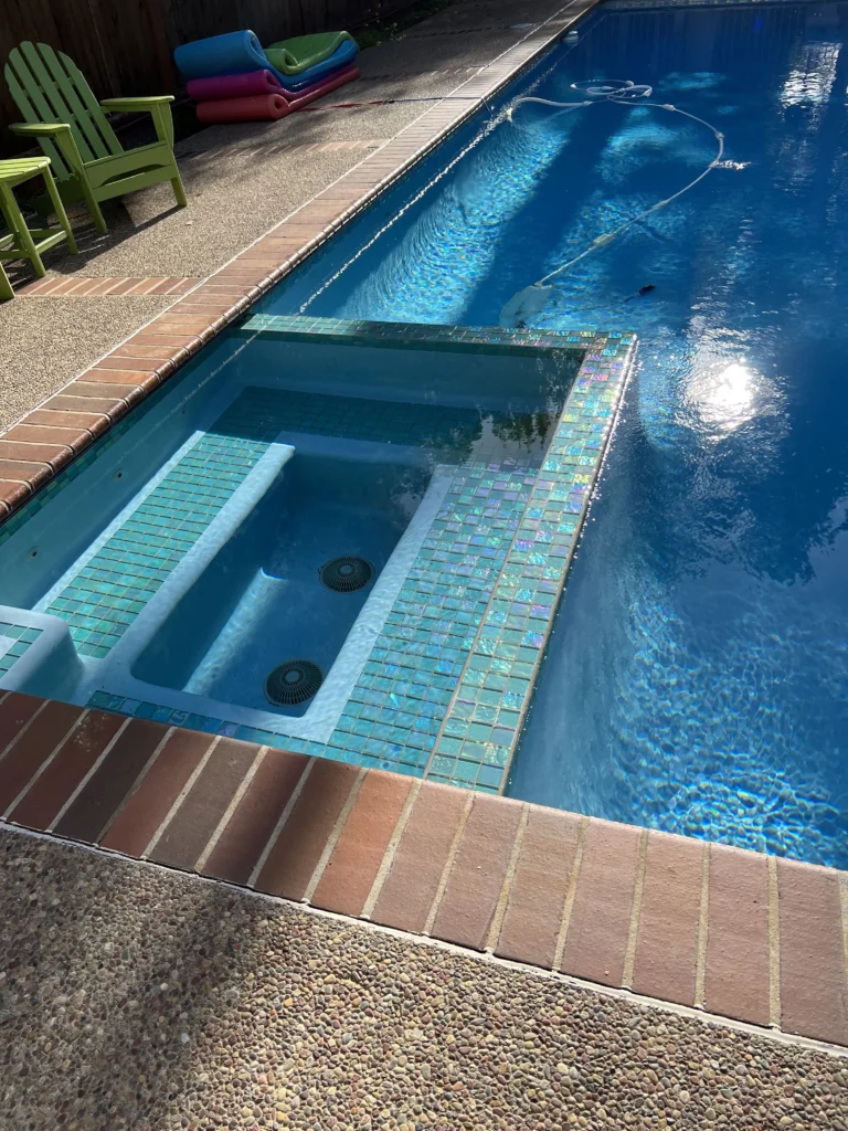 A swimming pool in a backyard.